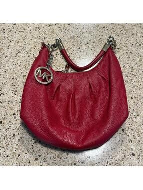 Red pebbled leather Michael kors bag